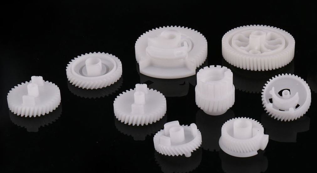 A collection of custom precision plastic spur gears, helical gears, and micro mechanisms by LiCoom-Motion.